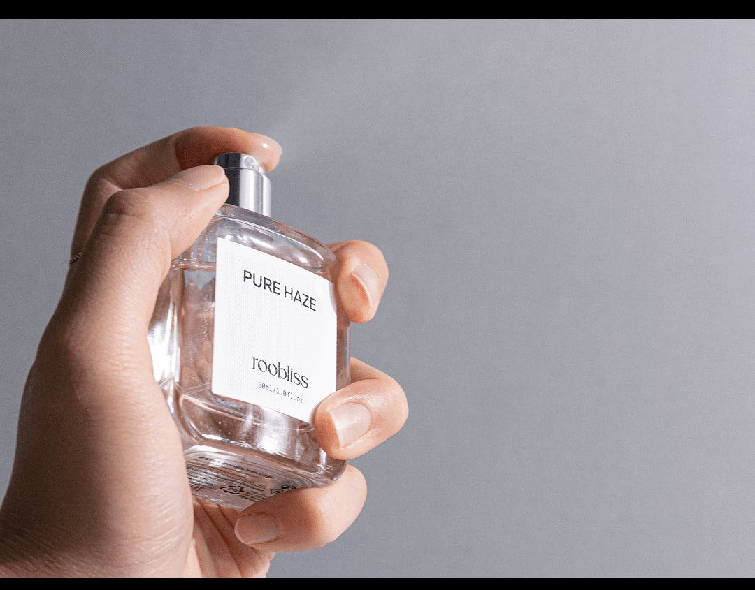 ROOBLISS Pure Haze Hair Perfume spray in hand