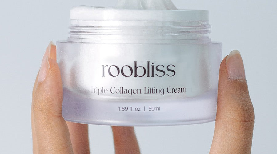 Triple Collagen Lifting Cream jar held in hand
